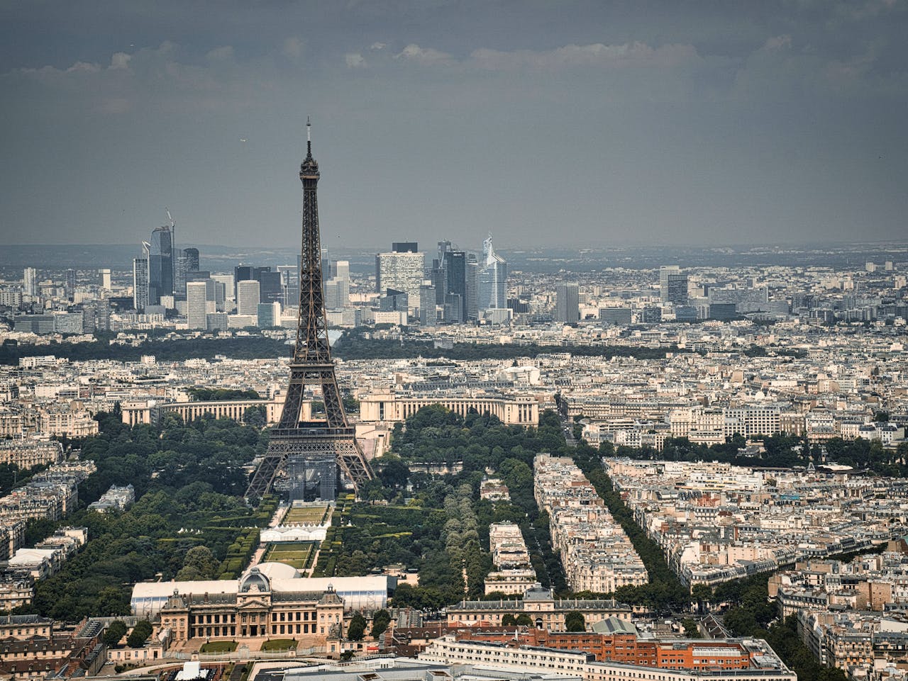 A stunning aerial shot of the Eiffel Tower with the Paris cityscape in the background, showcasing France's iconic landmark.